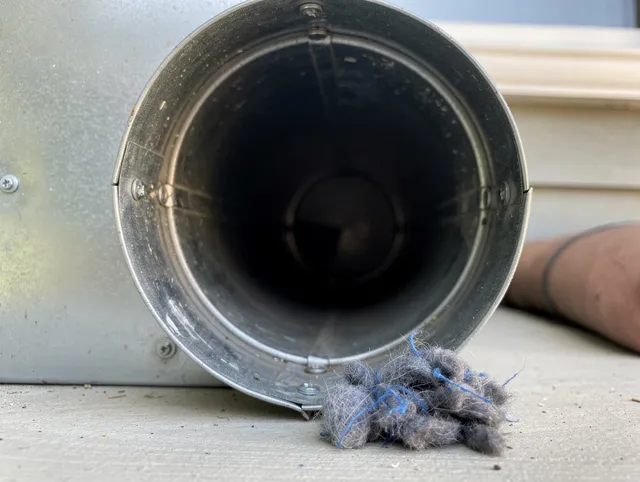 Beverly Hills Dryer Vent Cleaning technician using specialized equipment to clear severe dryer vent blockage in Beverly Hills